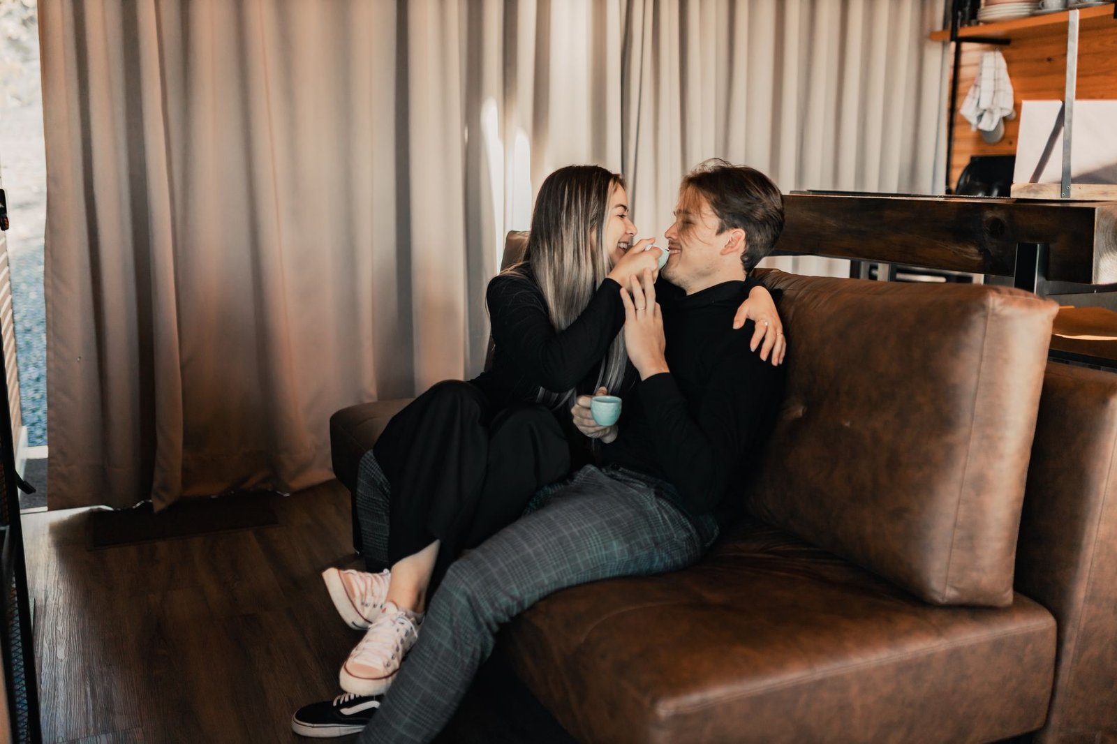Couple having a real conversation together on the sofa