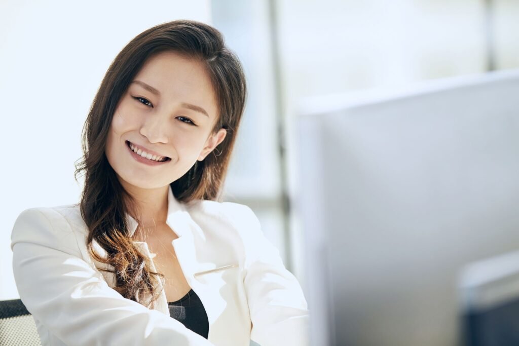 Confident businesswoman smiling at work