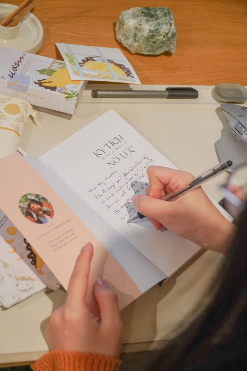 Woman writing a heartfelt letter to her long distance partner at her desk