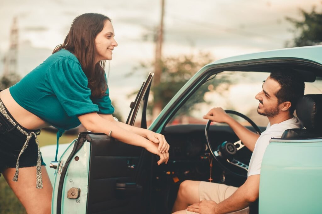 Couple sitting and talking inside a car