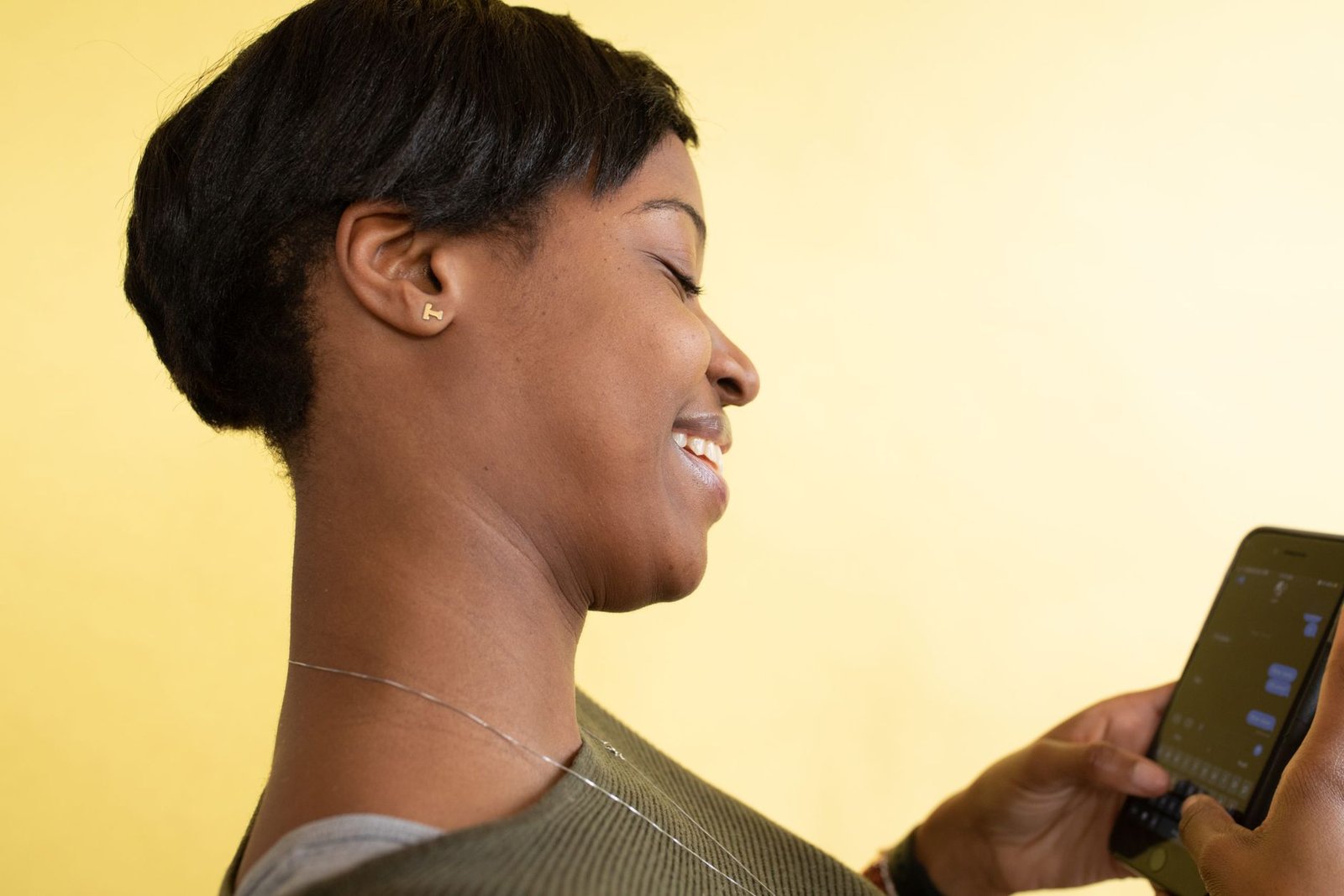 Woman smiling at a long thoughtful reply that arrived hours late