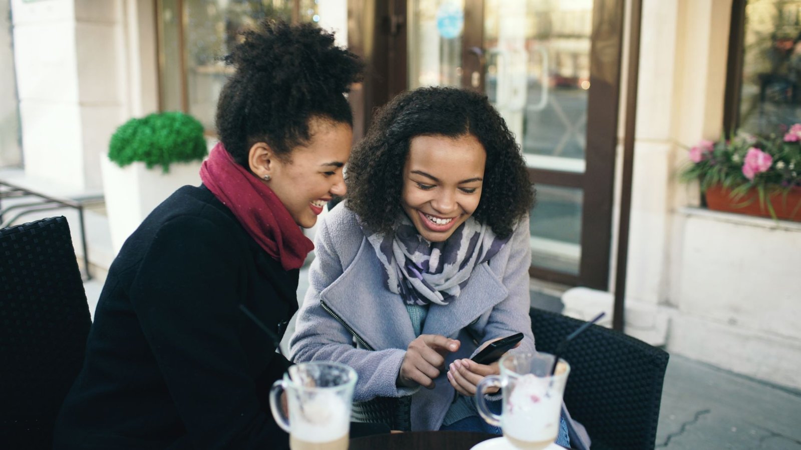 Woman out with friends while keeping her own life in a long distance relationship