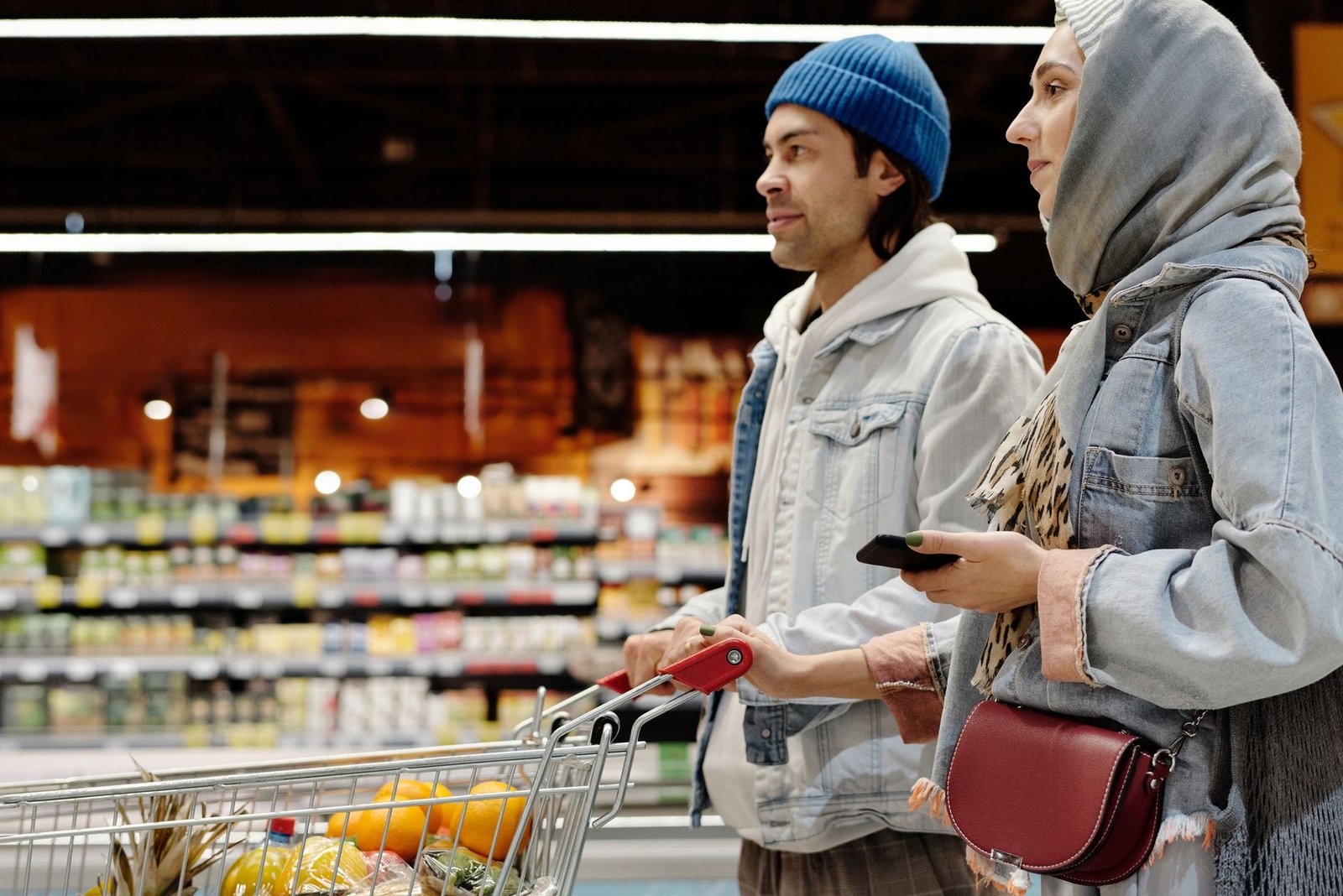 Couple picking produce together in the grocery store