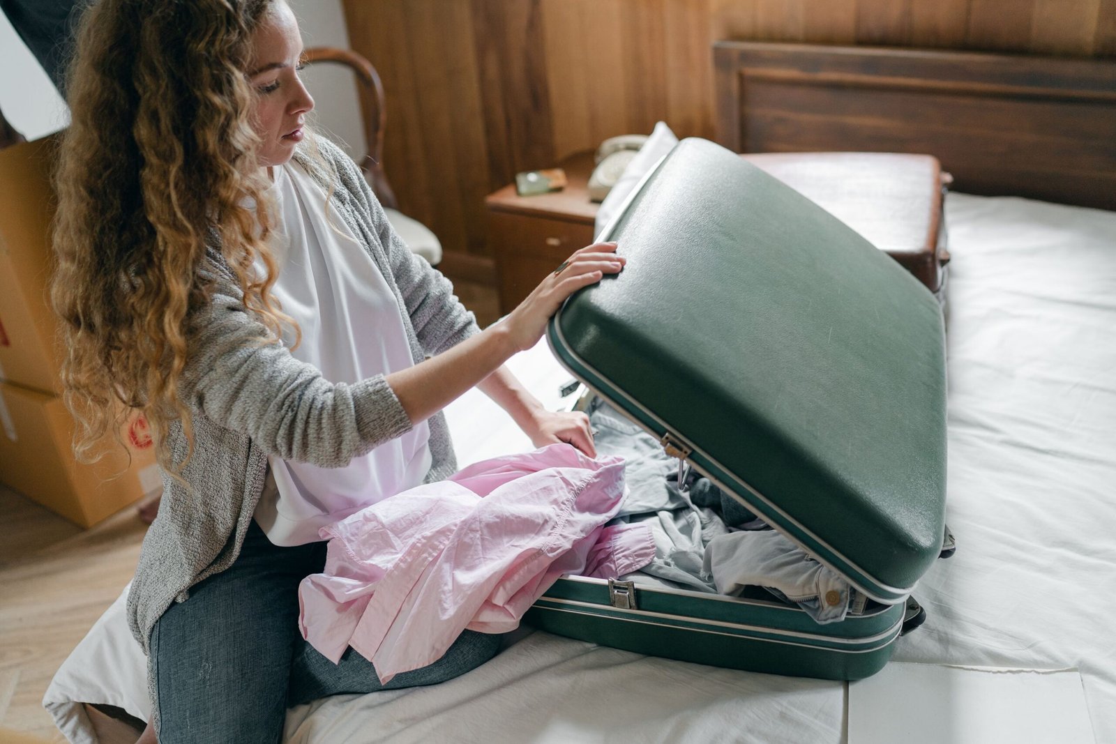 Woman packing a suitcase before a trip to visit her partner