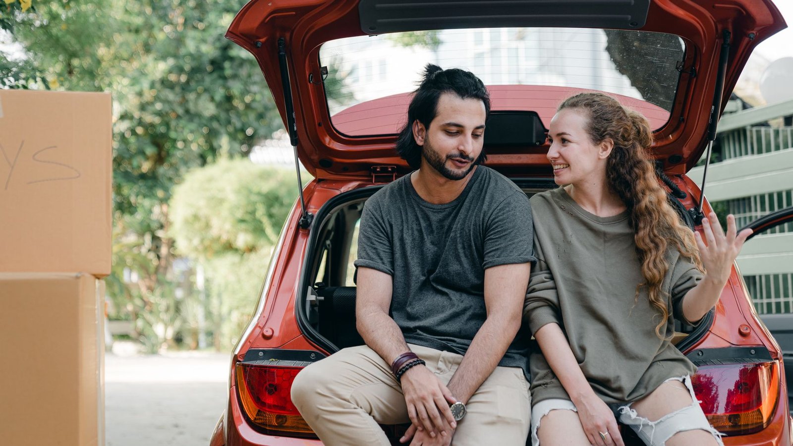 Woman and her boyfriend talking honestly in a car after a hard conversation