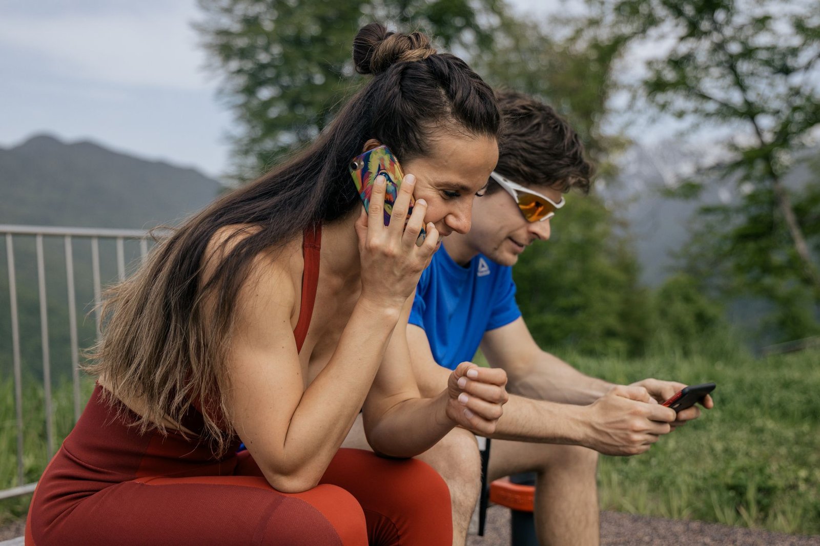 Man talking on the phone outdoors with a flat expression