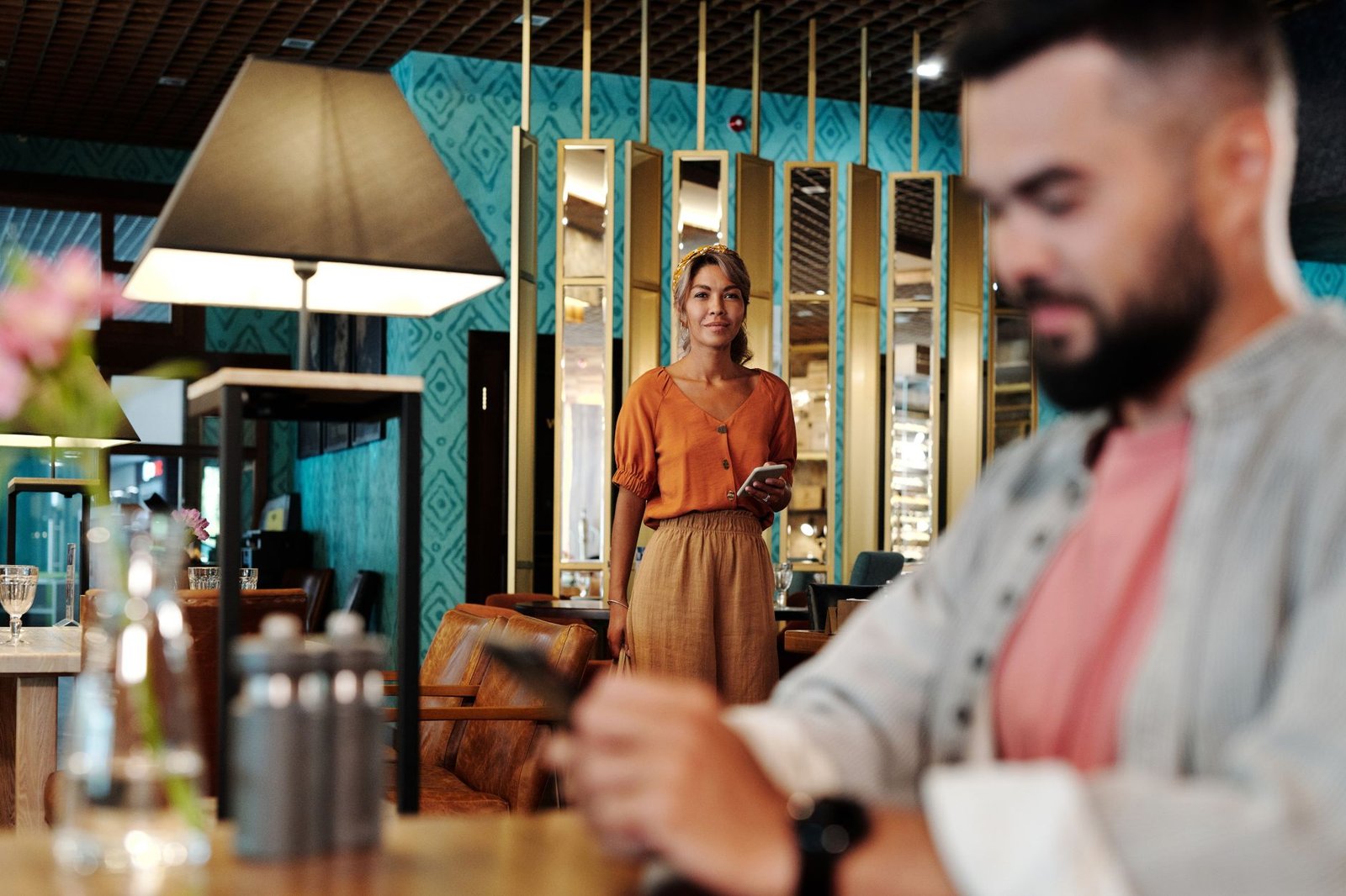 Couple sharing a warm first date at a modern restaurant table