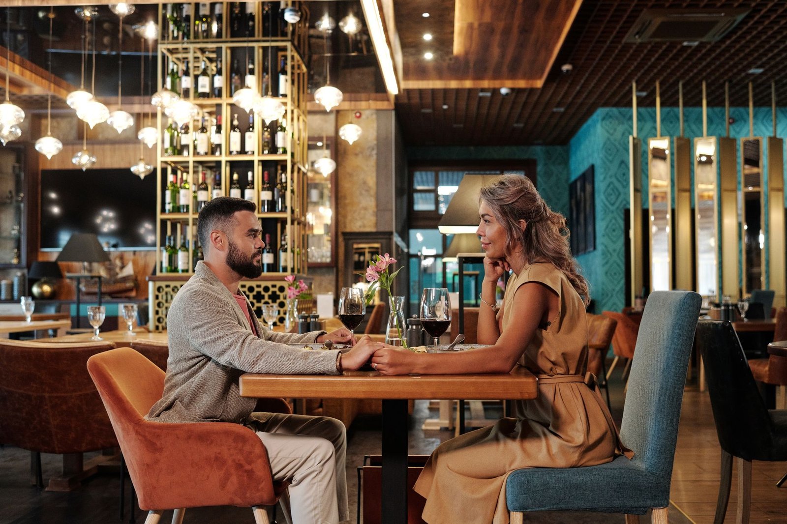Couple enjoying a romantic dinner date during a long distance relationship visit
