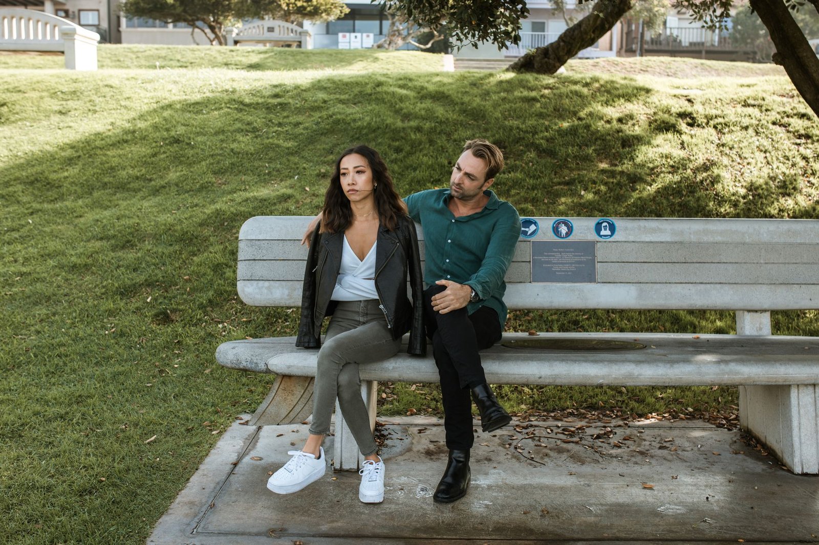 Couple sitting close having a serious conversation