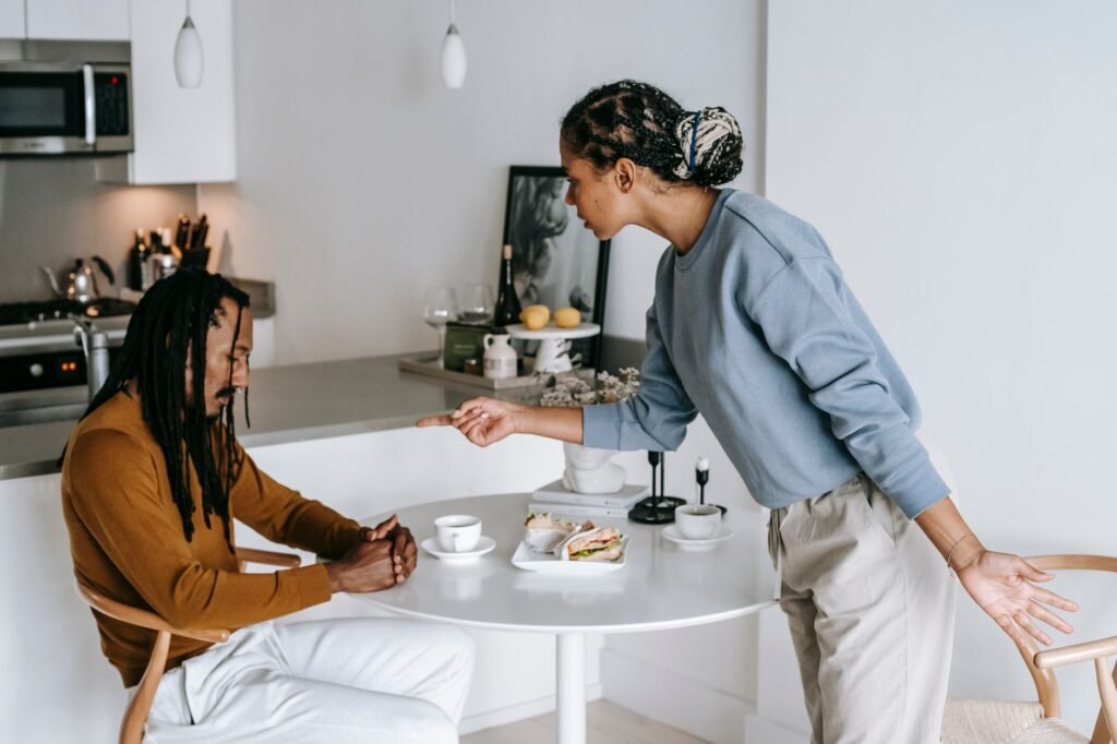 Couple talking things through at the kitchen table