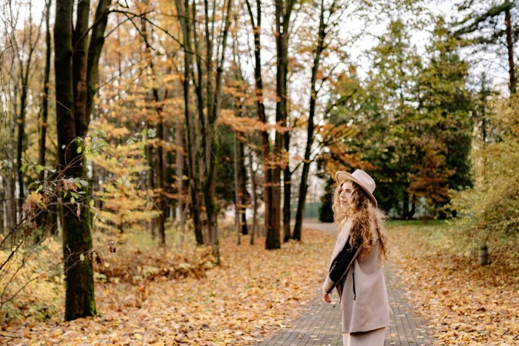 Woman walking alone through a park during a no contact pause after a breakup
