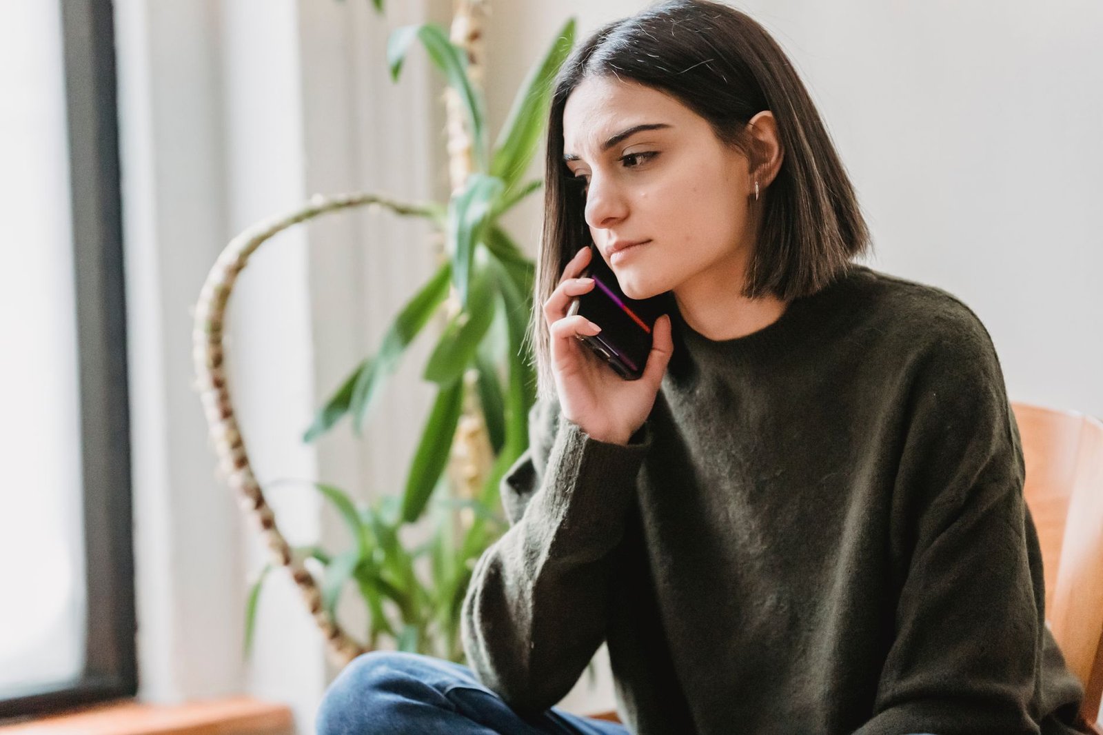 Woman having a serious phone call with her long distance partner