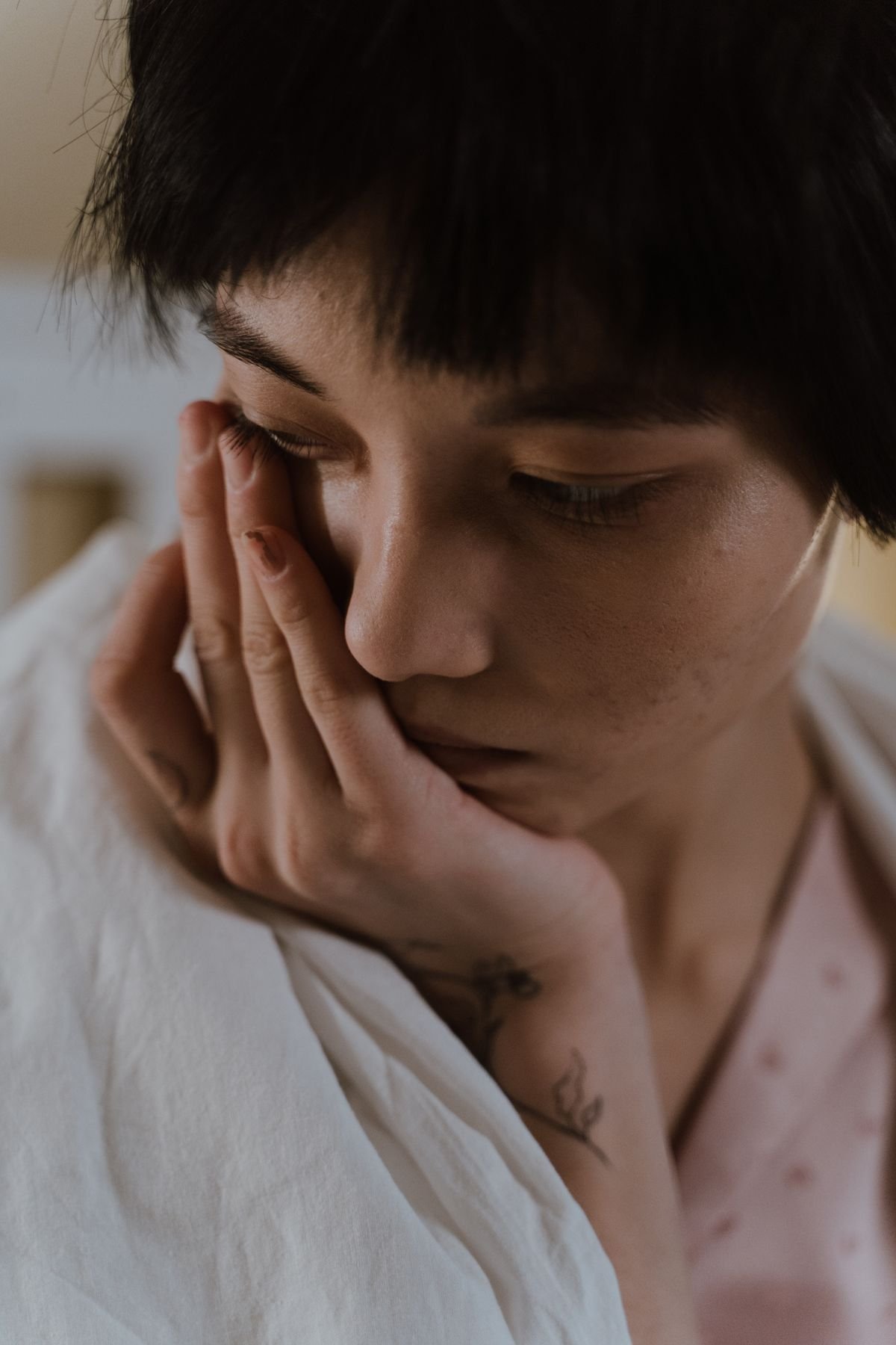 Woman wrapped in a blanket having a bad long distance relationship day