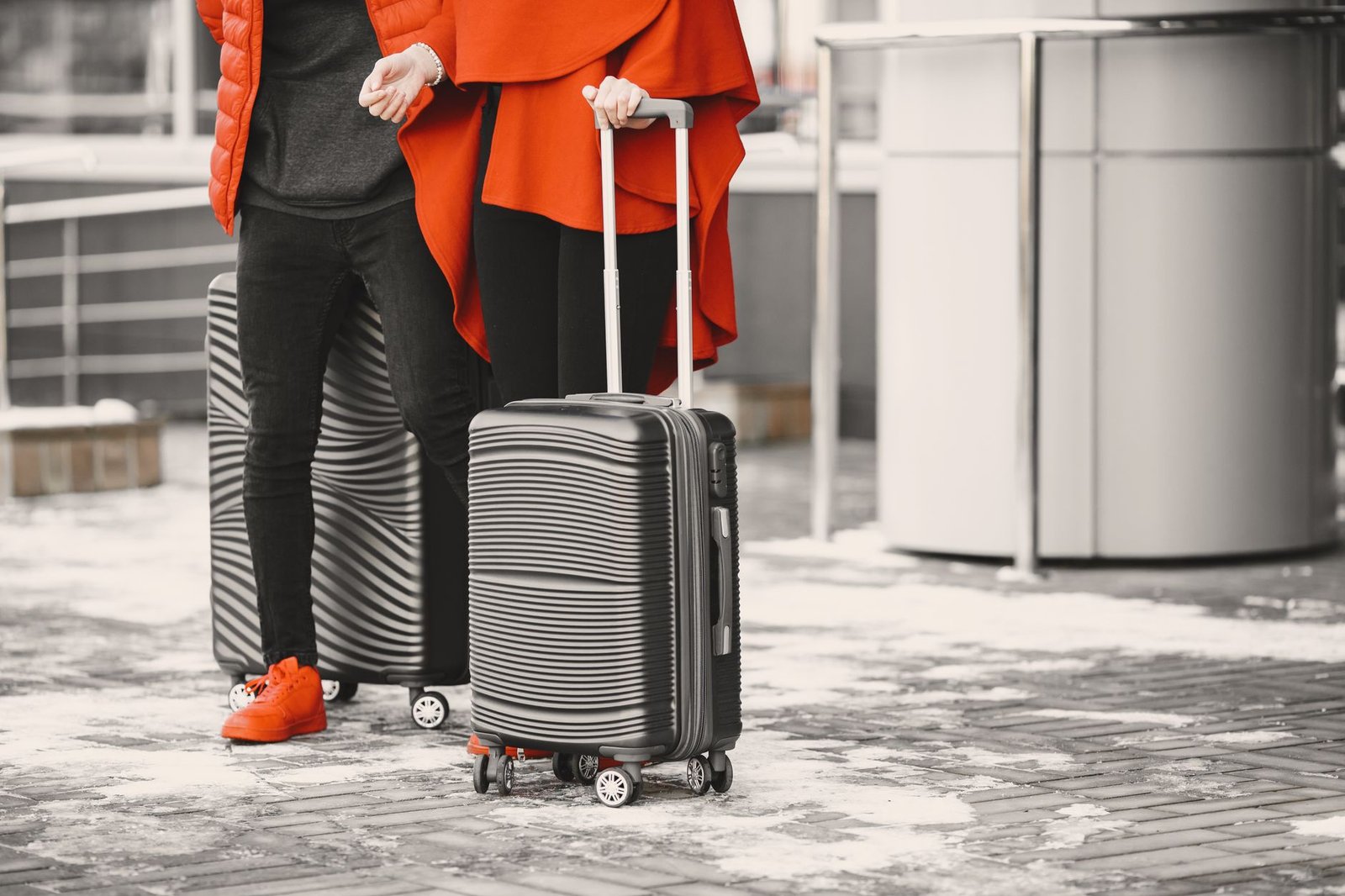 Couple walking through the airport with luggage for their long distance visit