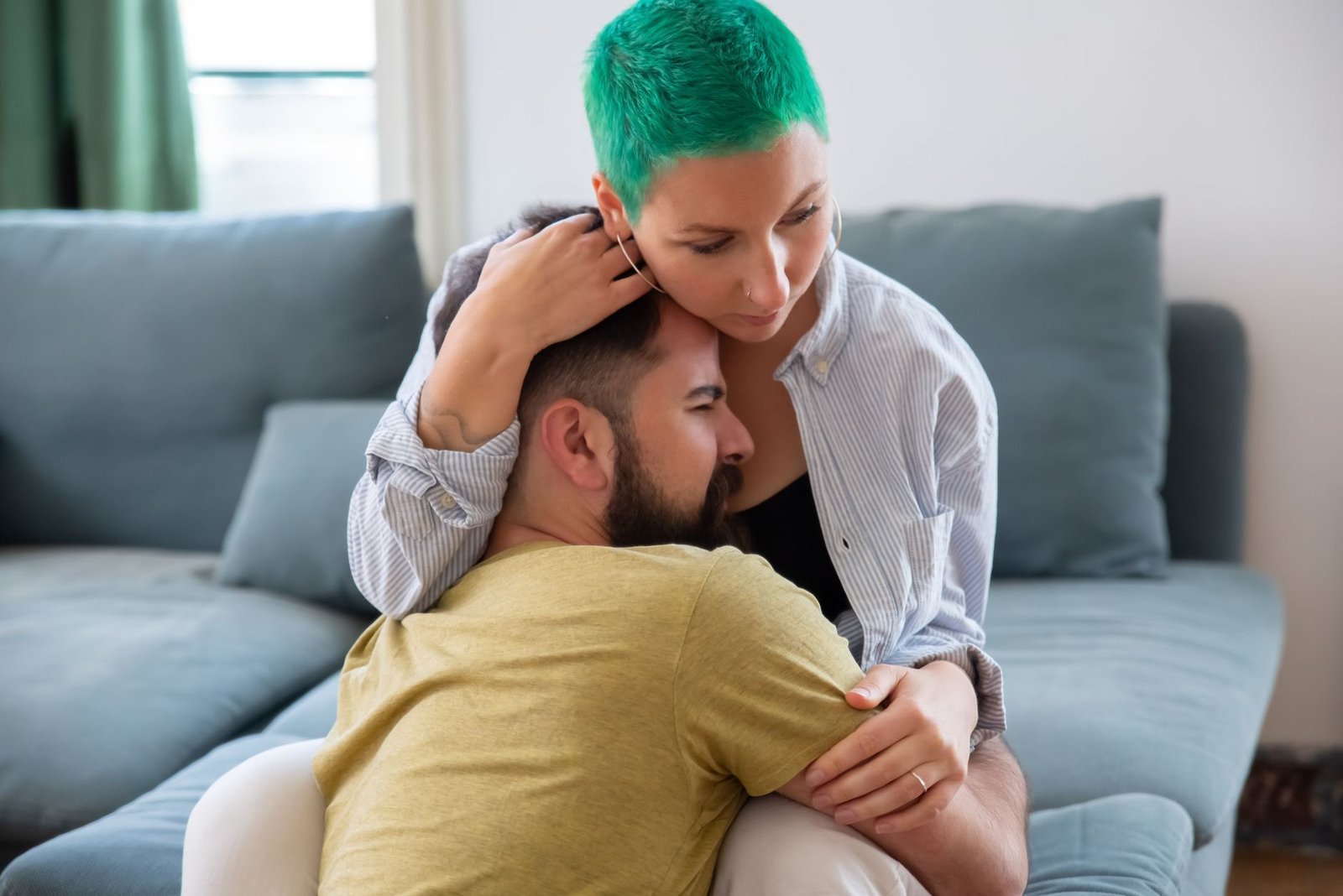 Close up of a couple hugging warmly at home