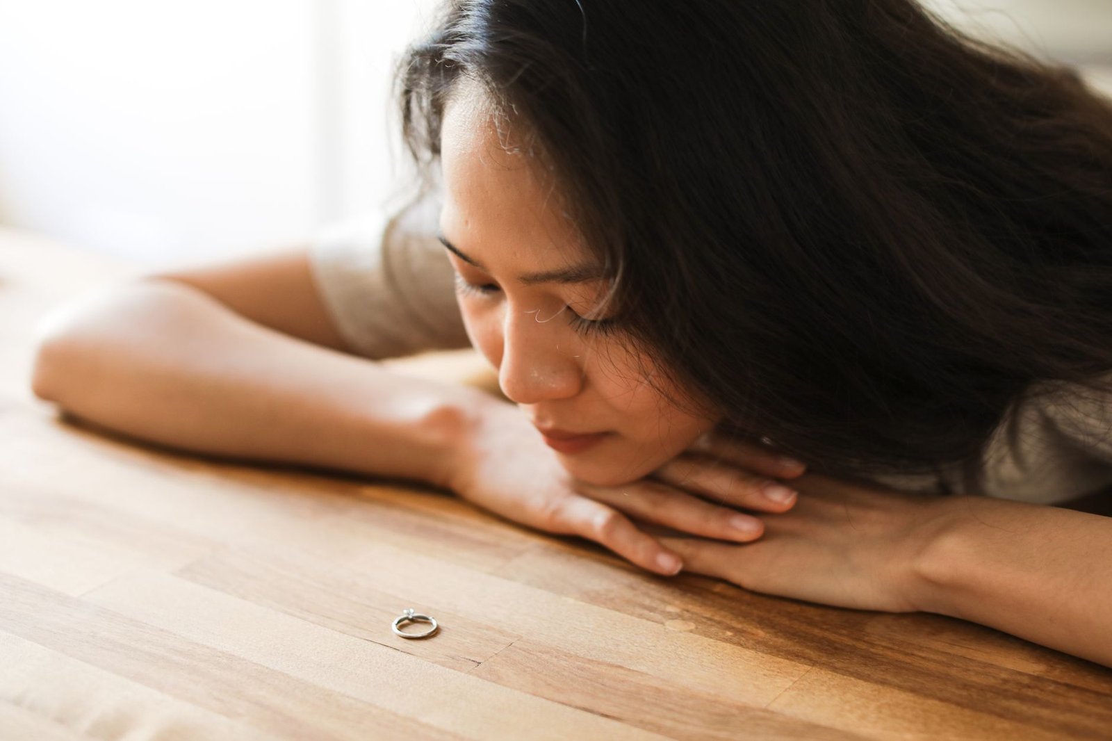 Woman thinking quietly about doubts during a long engagement before her wedding