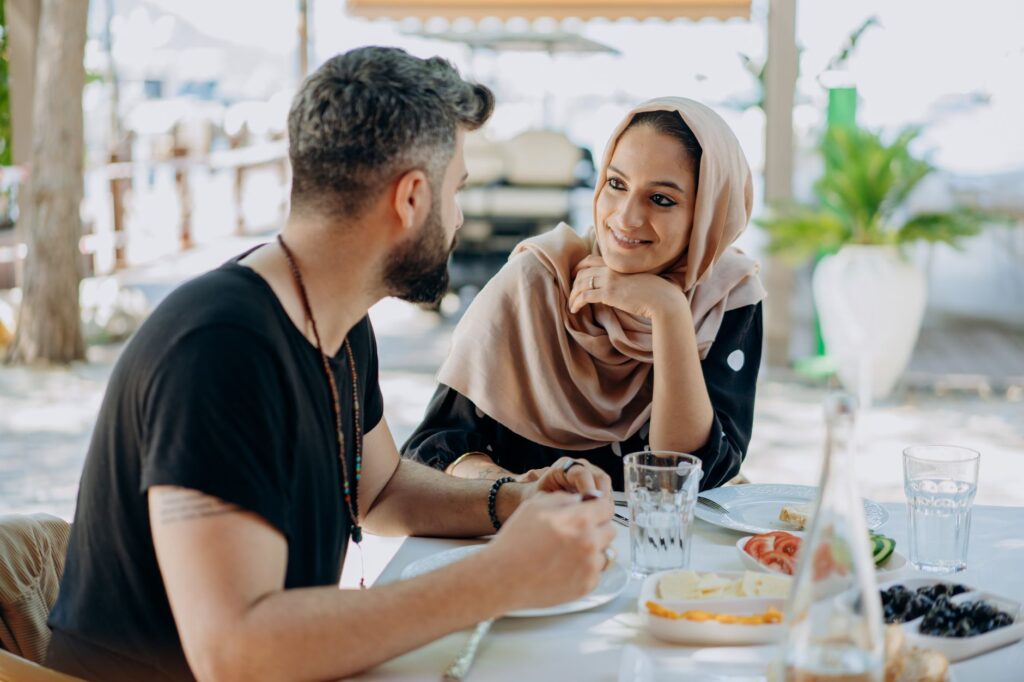 Couple talking through a decision at a restaurant