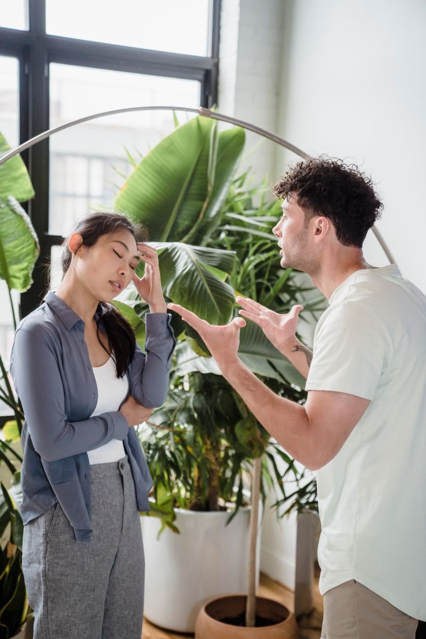 Man and woman having a heated argument indoors