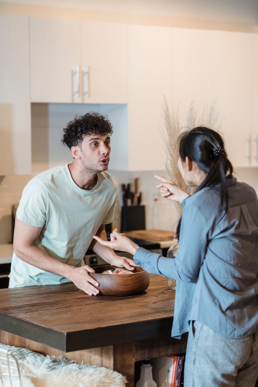Couple arguing in a modern kitchen