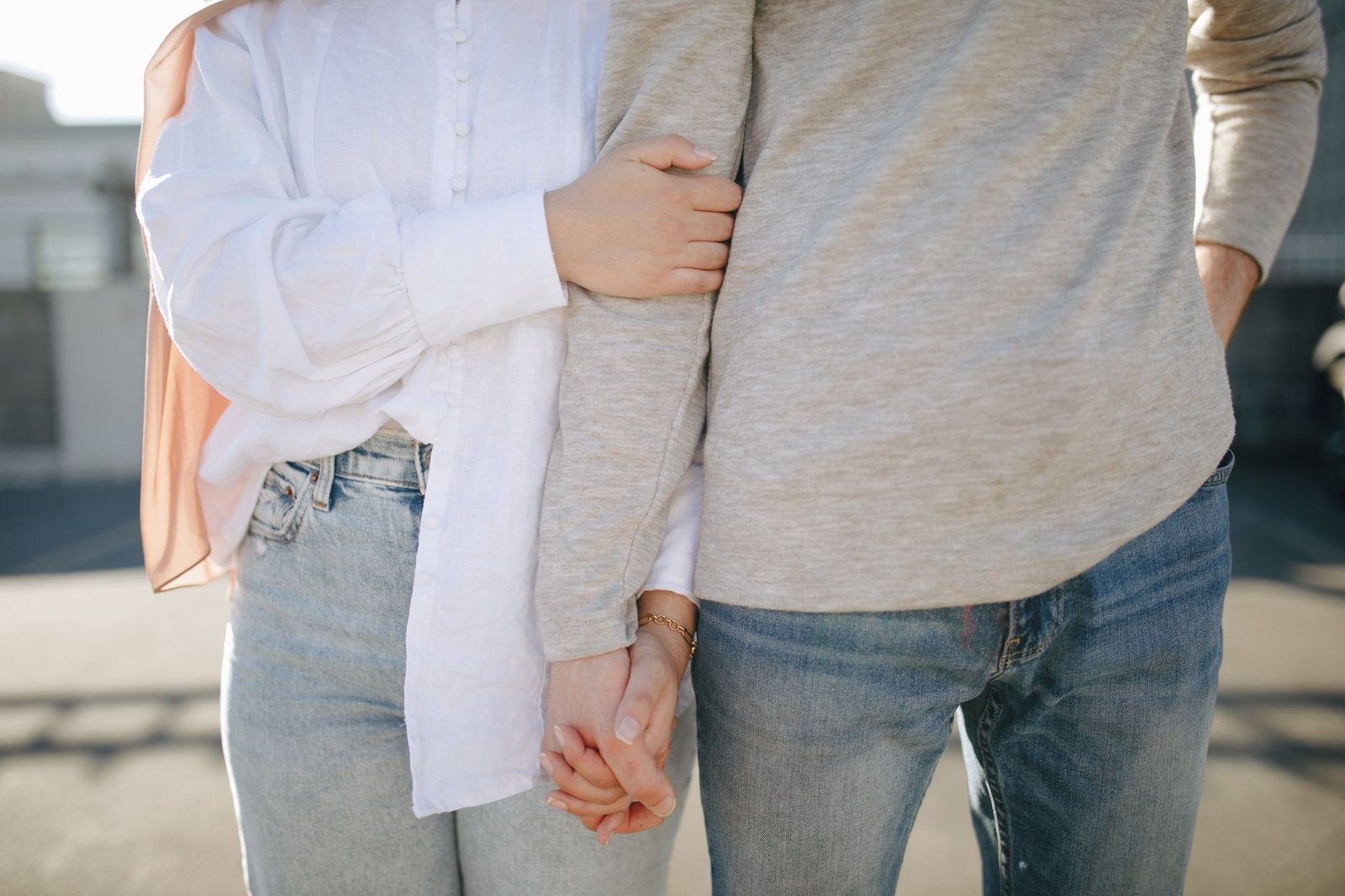 Couple holding hands, a symbol of trust in a long distance relationship