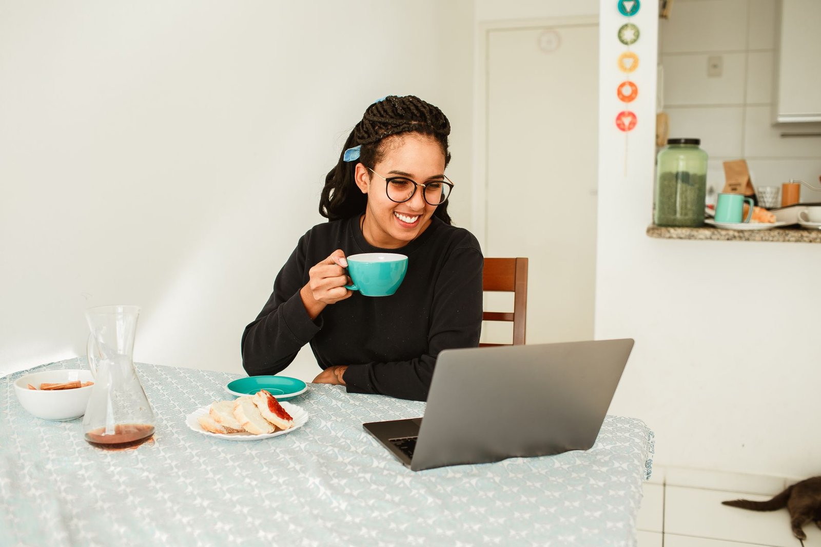 Woman on a video call with coffee, a daily check-in idea for long distance couples