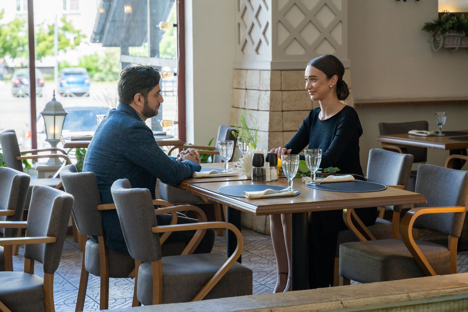 Couple enjoying a warm first date dinner in a cozy cafe