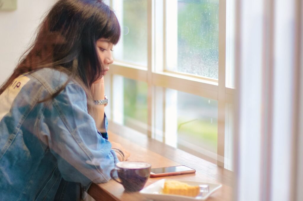 Woman alone in a cafe with coffee after her boyfriend asked to stay friends