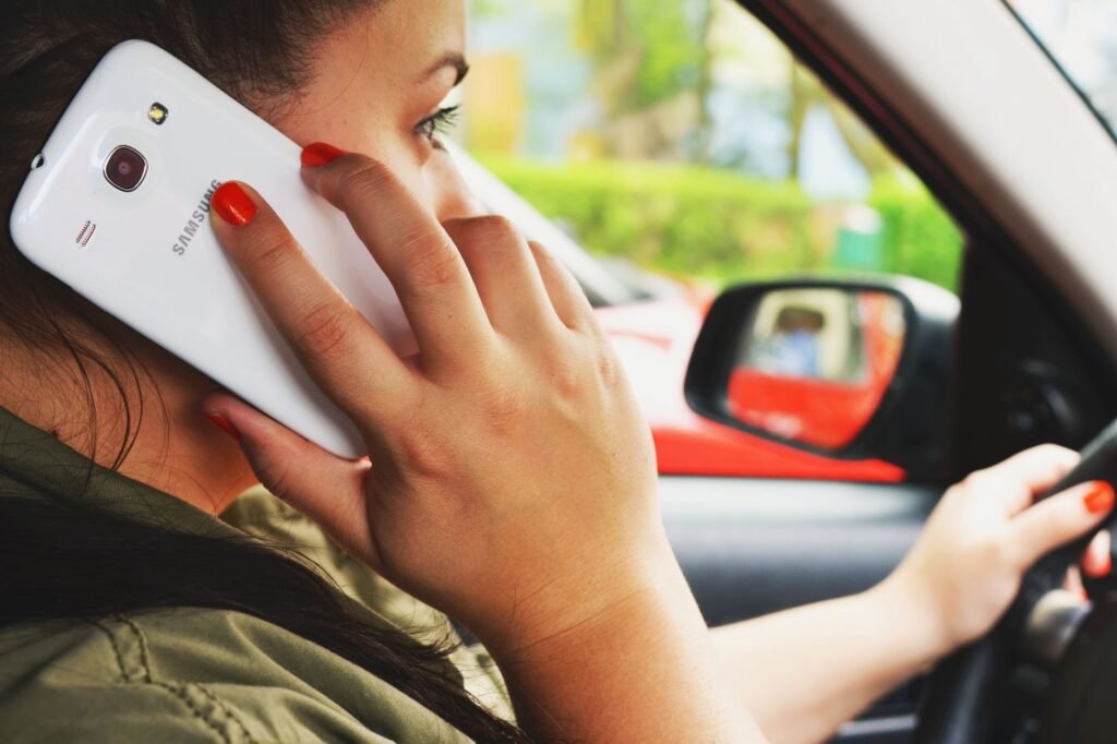 Woman holding her phone thinking about a text to send her partner