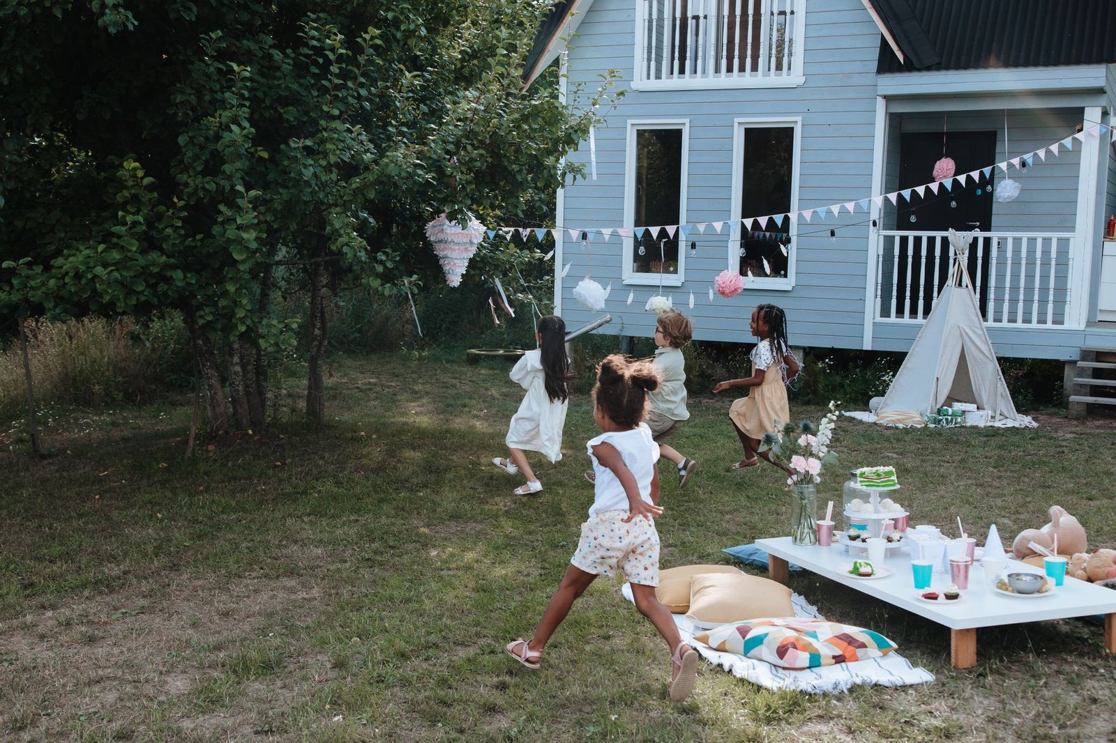 Family celebrating together outdoors during a summer backyard proposal