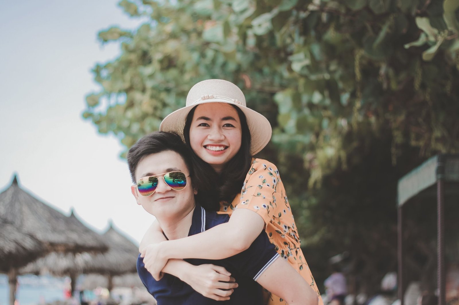 Couple smiling together outdoors after two years of dating closely