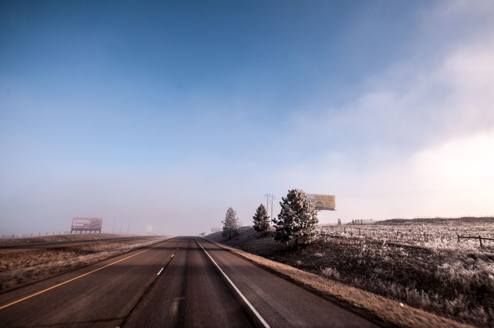 Couple driving on the highway on a Sunday morning