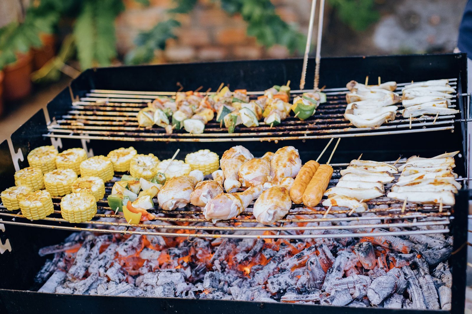 Grill smoking at a summer backyard barbecue