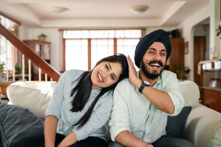 Woman smiling while sharing good news with her boyfriend at home