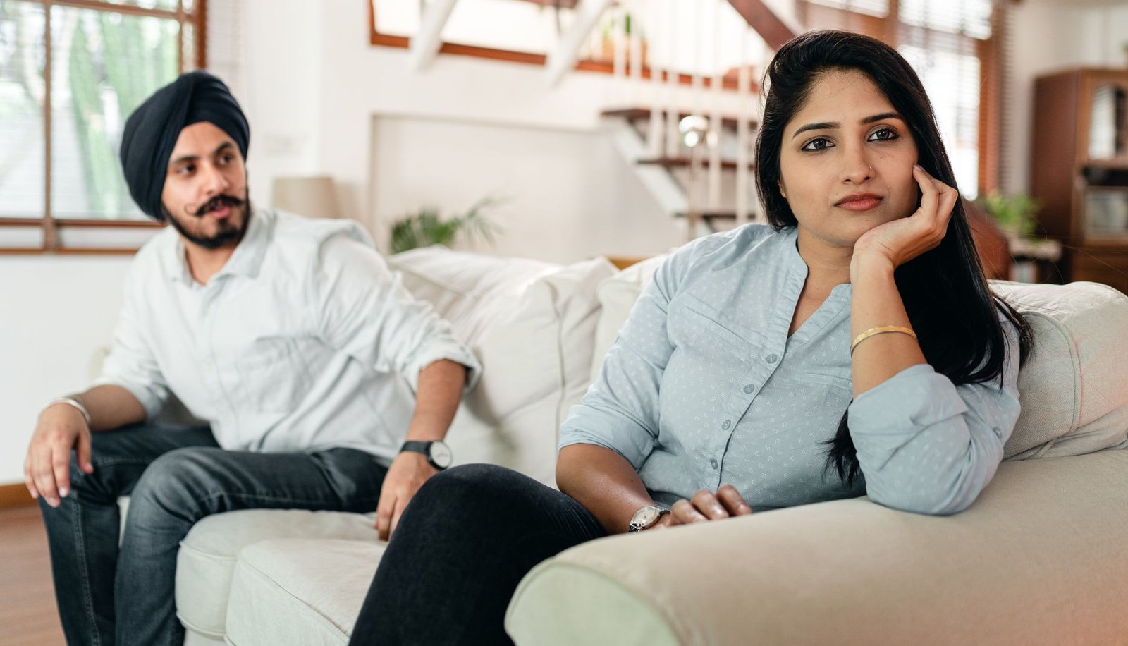 Couple reconciling with a hug at home after days of silence