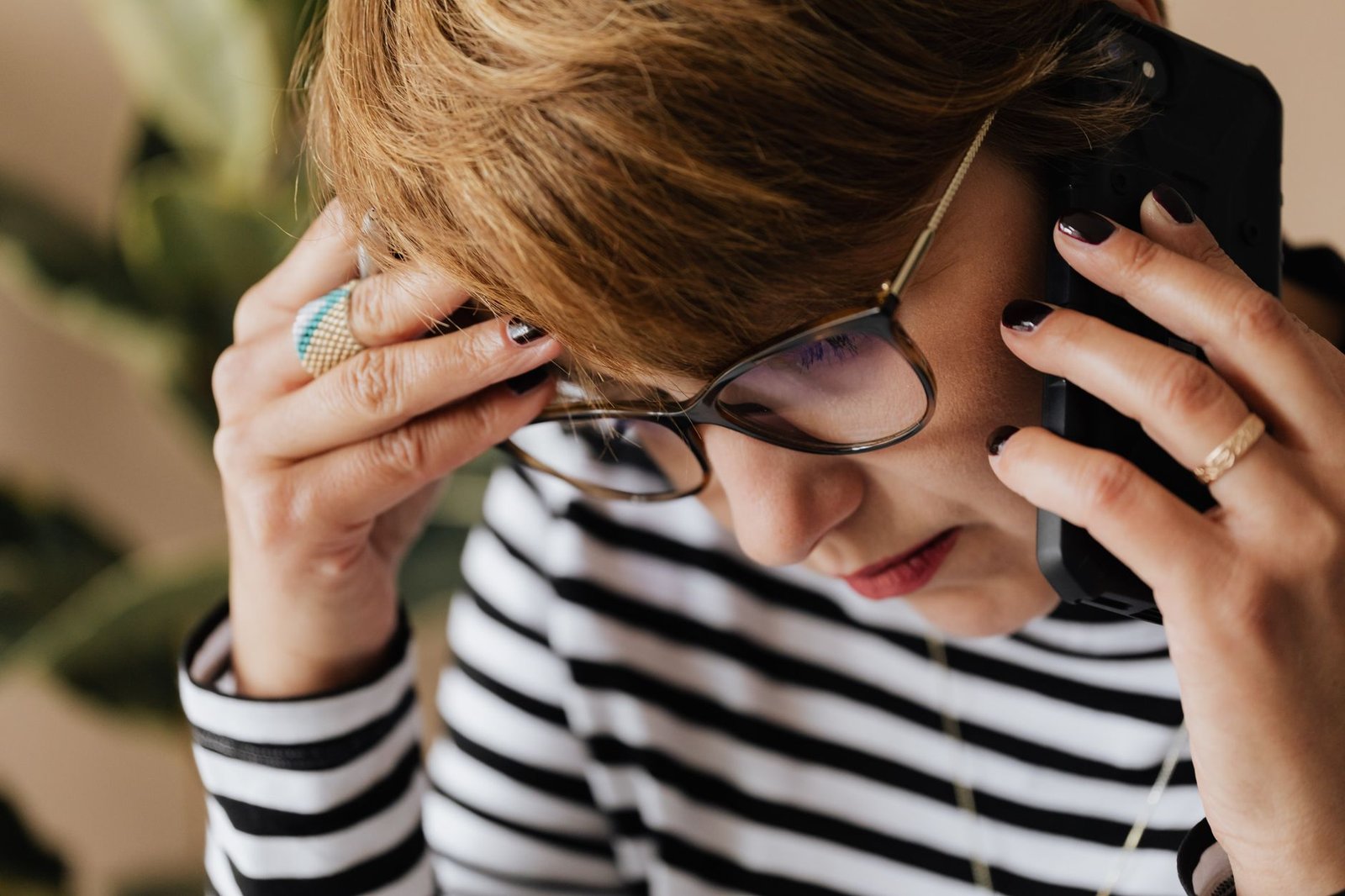 Woman looking worried while waiting for a text reply