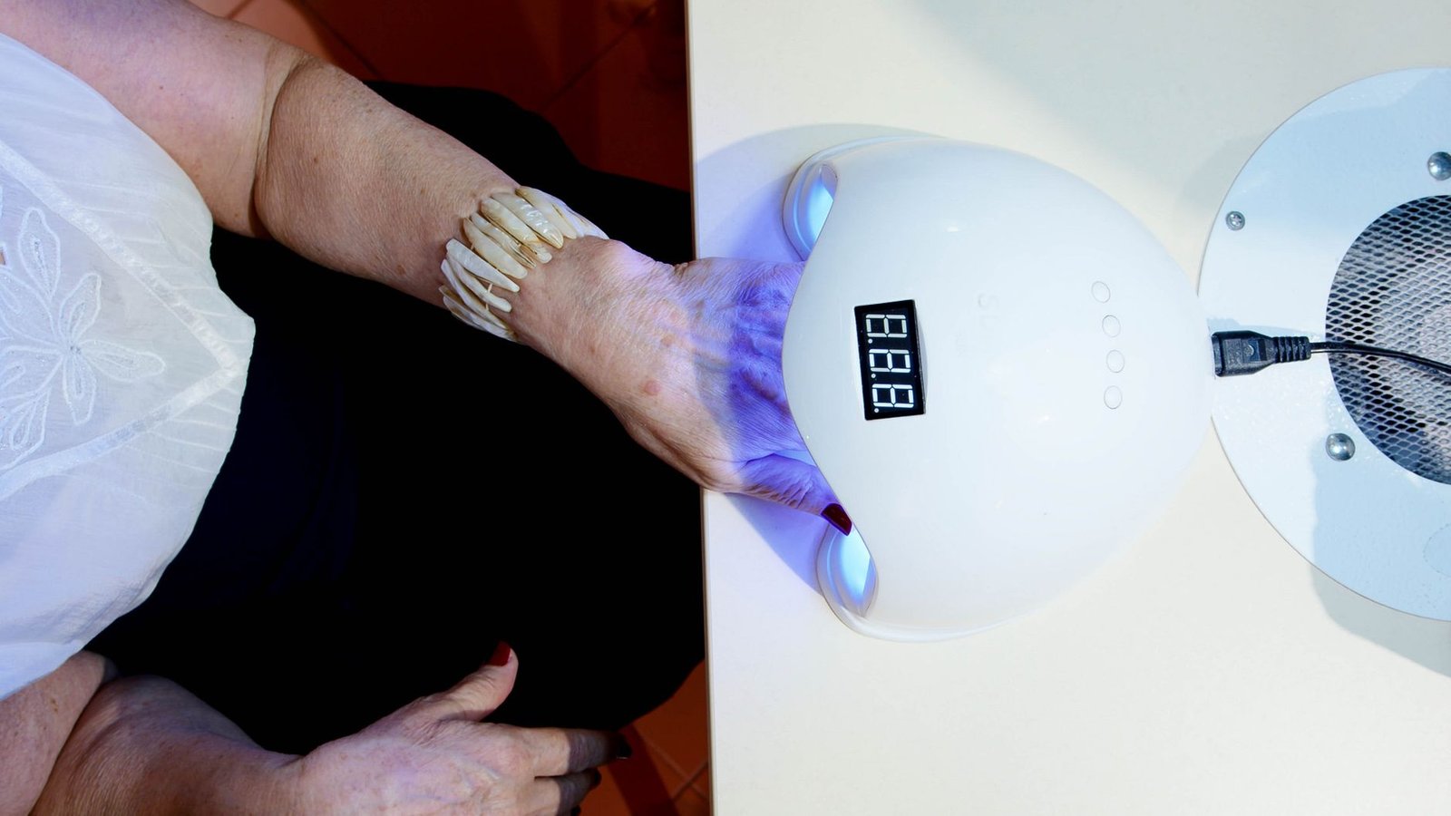 Woman getting a manicure at a nail salon the day she learned her ring size secret