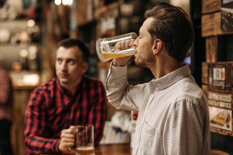 Woman at a brewery trivia night on a second date with two men at the table