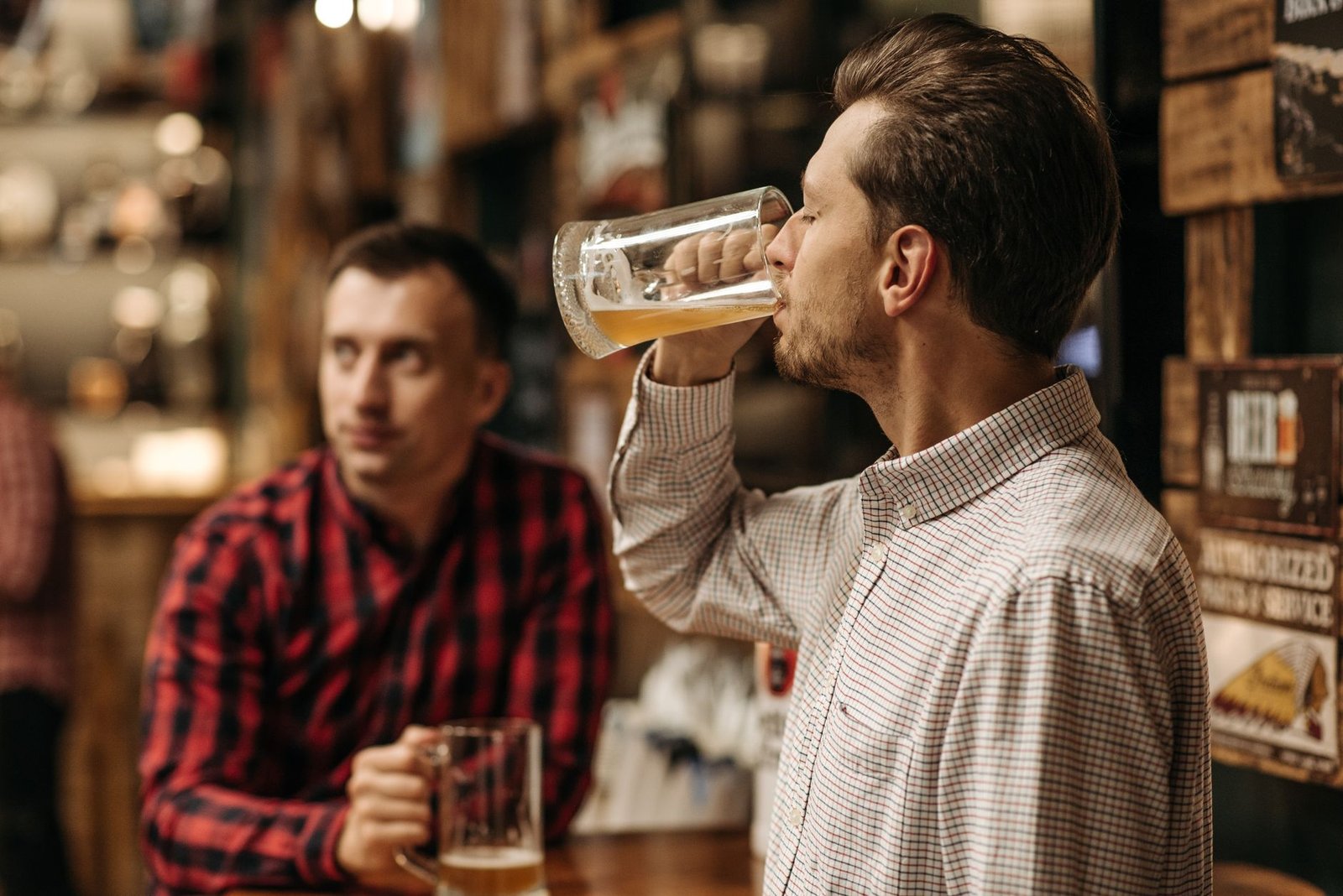 Woman at a brewery trivia night on a second date with two men at the table