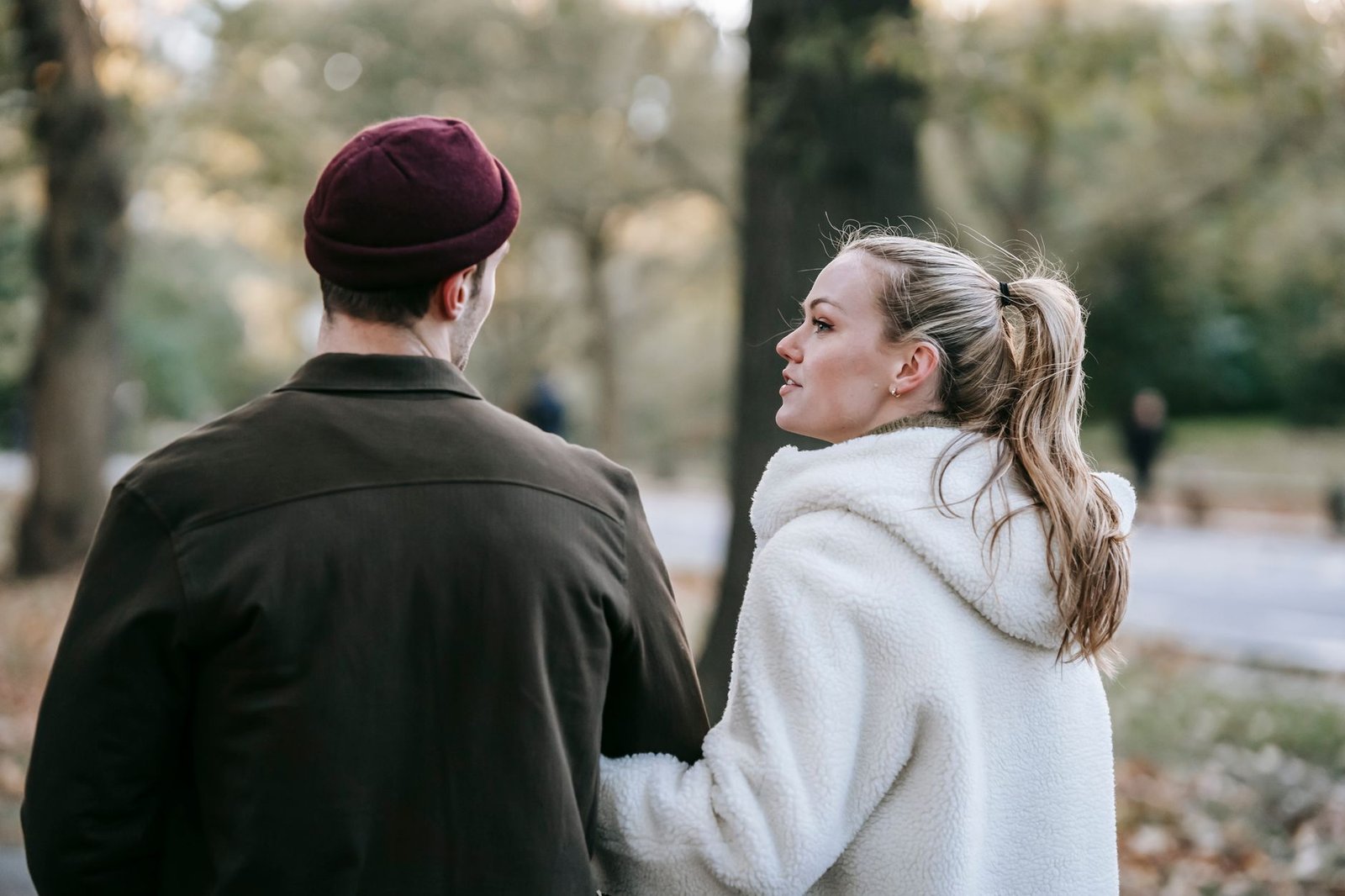 Couple talking gently on an autumn walk after a birthday proposal