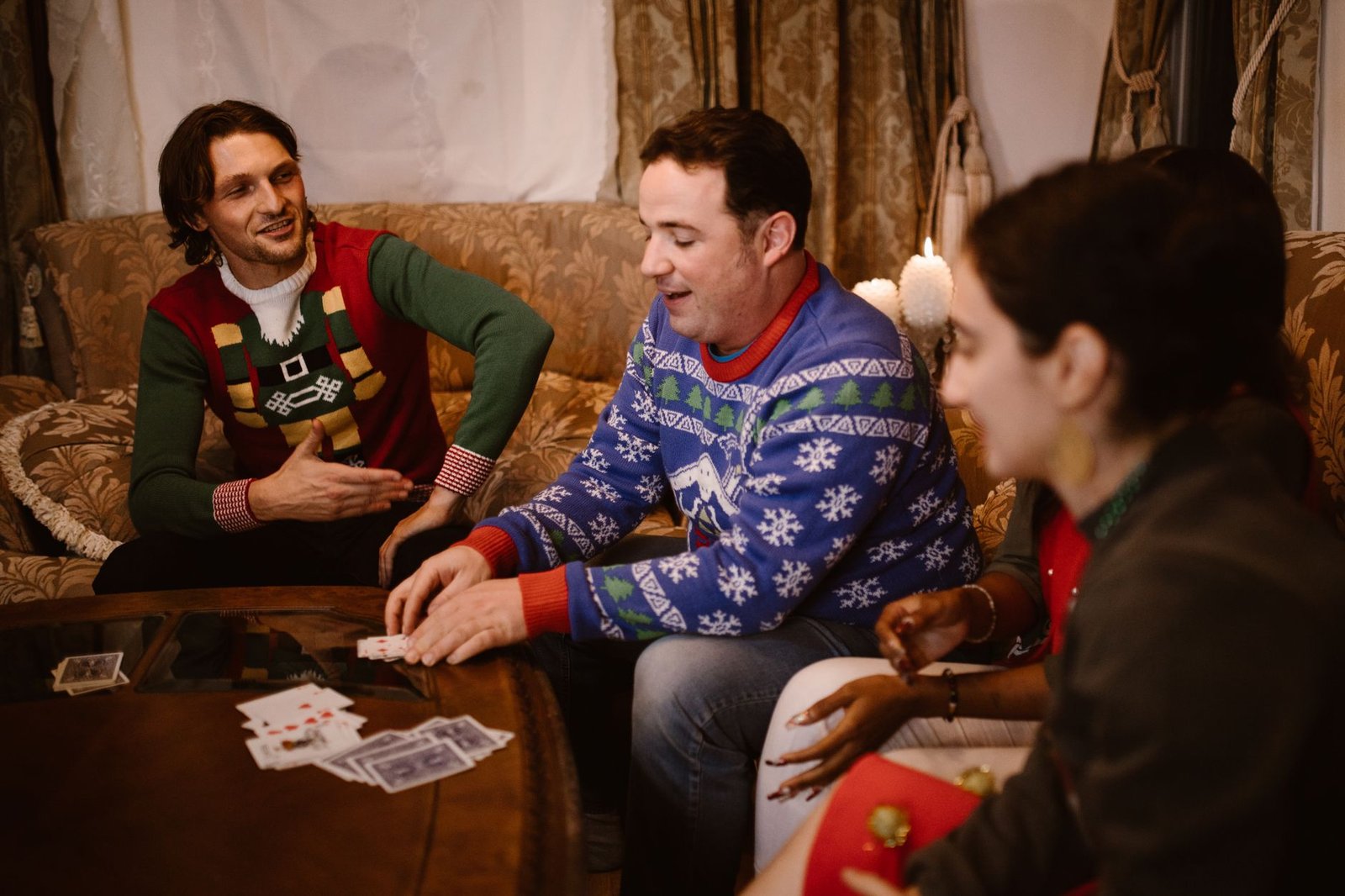 Couple laughing while playing cards on a Friday night with no chores allowed