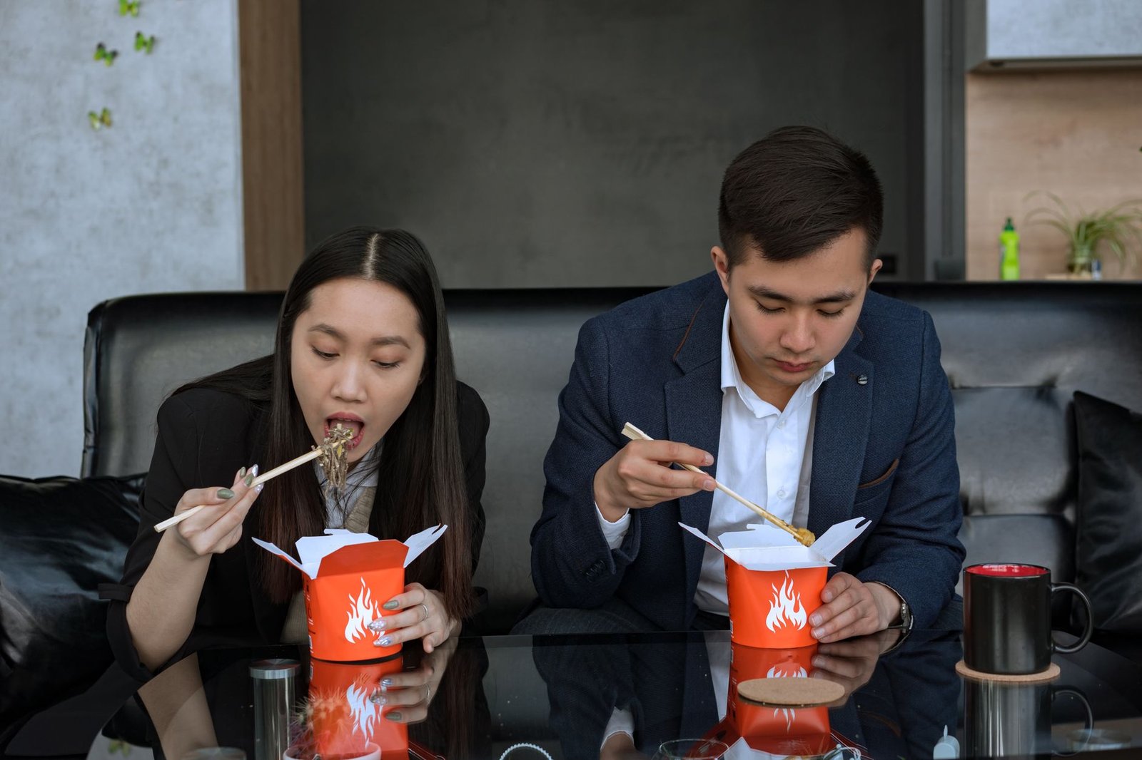 Couple sharing a casual lunch at a noodle shop near his office