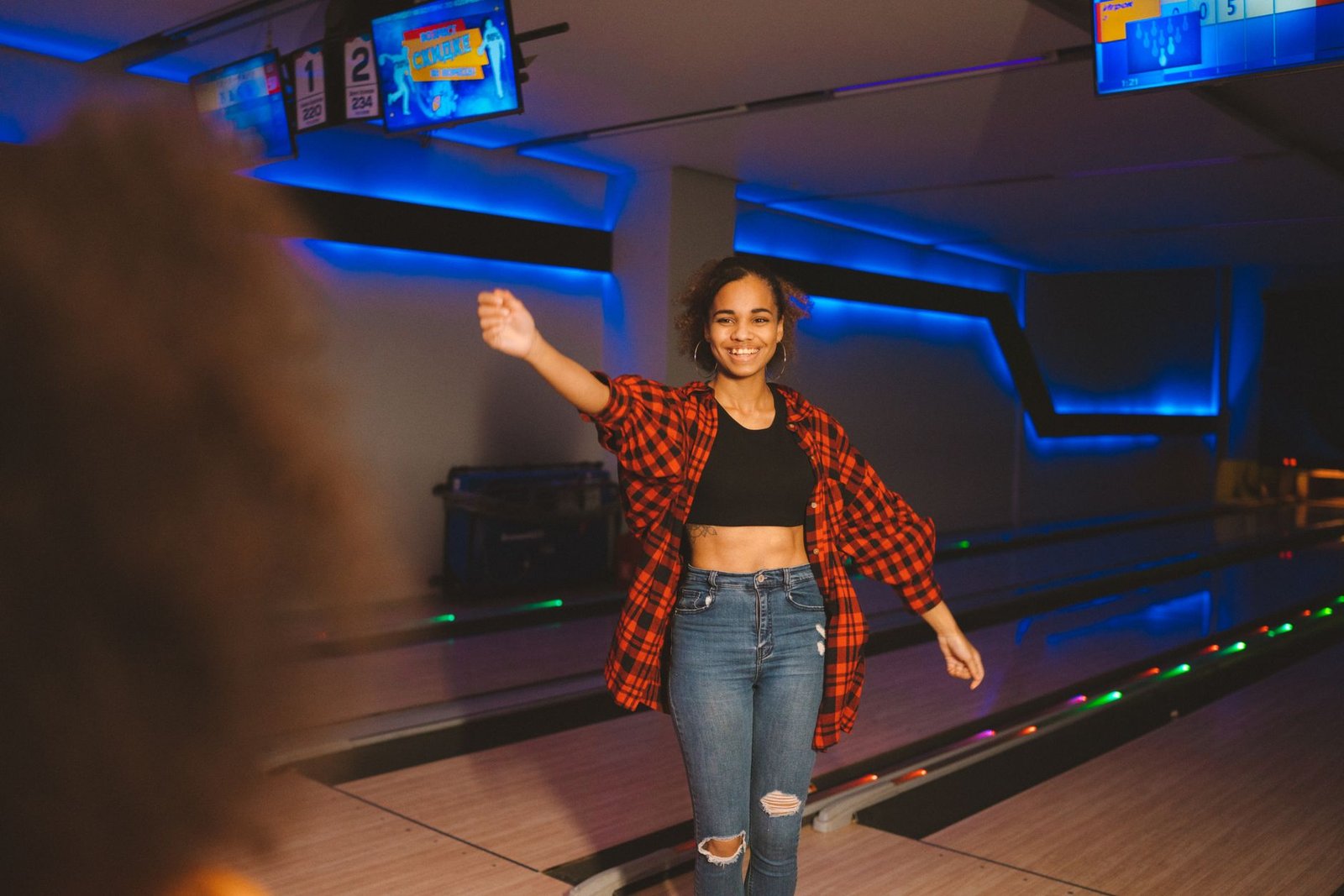 Group of friends celebrating a backup birthday at a bowling alley