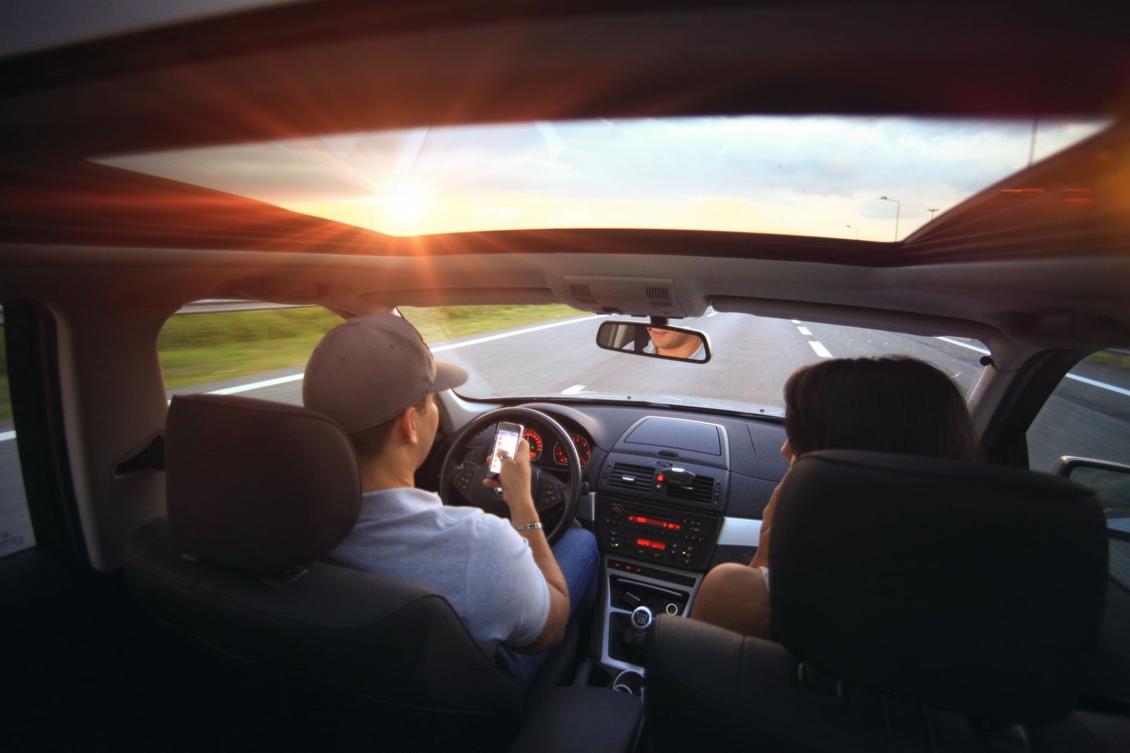 Couple talking in the car on the drive home after a night out with couple friends